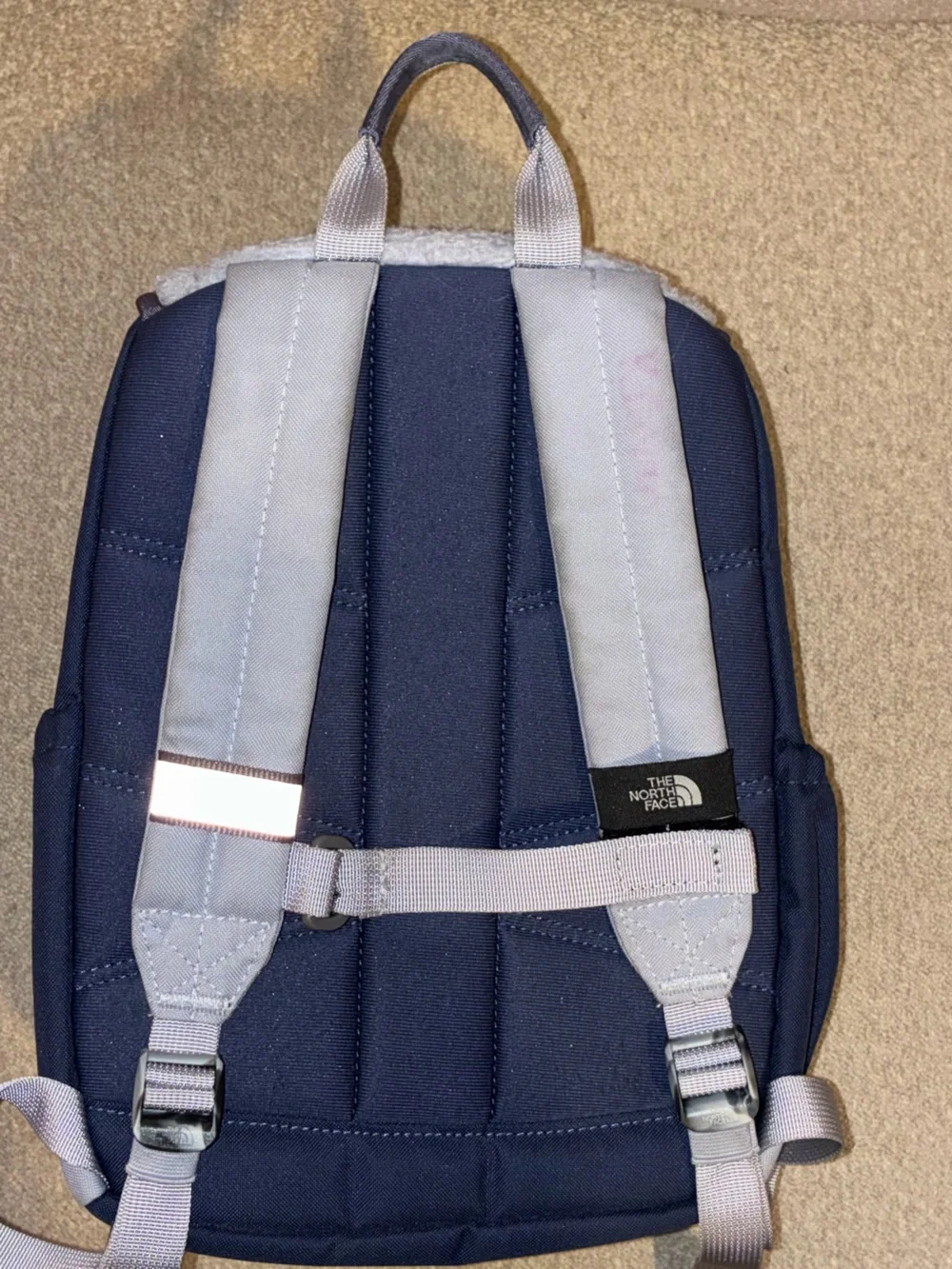 The North Face Kids Navy and Light Gray Backpack with Red & Green Pulls